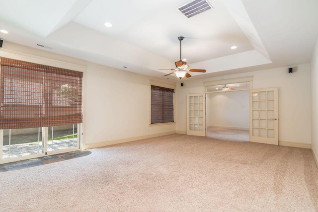 903 Silver Bluff Cir, Branson West, MO 65737 - unfurnished living room with carpet, a ceiling fan, a tray ceiling, recessed lighting, and baseboards