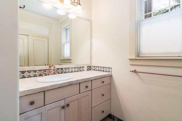 903 Silver Bluff Cir, Branson West, MO 65737 - bathroom featuring vanity and tasteful backsplash