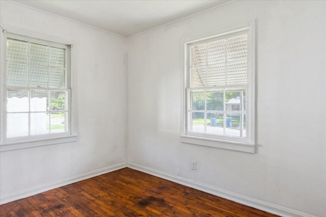 1823 W Olive St, Springfield, MO 65802 - empty room featuring crown molding, dark wood-style flooring, and baseboards