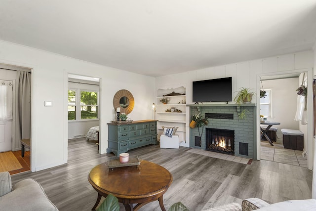 305 Cliff Dr, Branson, MO 65616 - living room with a fireplace and wood finished floors