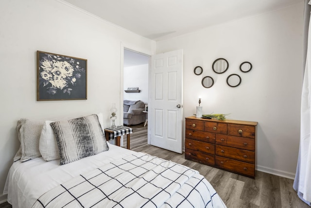 305 Cliff Dr, Branson, MO 65616 - bedroom with wood finished floors and crown molding