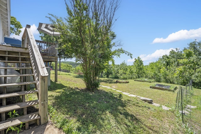 305 Cliff Dr, Branson, MO 65616 - view of green lawn featuring a garden, stairs, and a wooden deck
