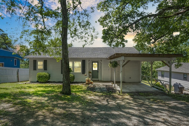 305 Cliff Dr, Branson, MO 65616 - ranch-style home featuring a carport, a shingled roof, and driveway