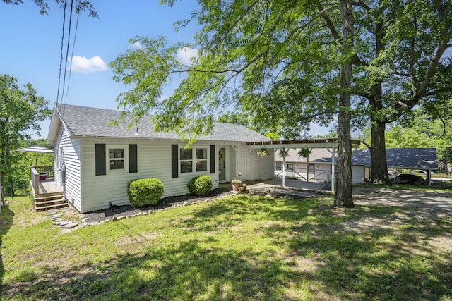305 Cliff Dr, Branson, MO 65616 - ranch-style house featuring a wooden deck, a front yard, and roof with shingles