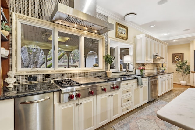 5575 S Castlebay Dr, Springfield, MO 65809 - kitchen featuring appliances with stainless steel finishes, wall chimney range hood, decorative backsplash, a sink, and crown molding