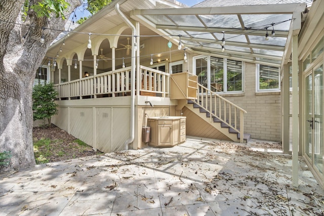 5575 S Castlebay Dr, Springfield, MO 65809 - rear view of property with stairs, a patio, and brick siding