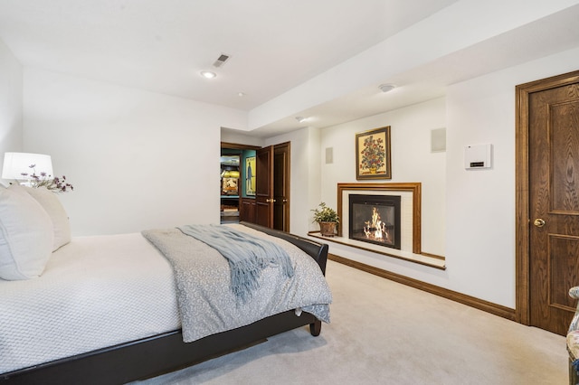 5575 S Castlebay Dr, Springfield, MO 65809 - bedroom featuring light colored carpet, a lit fireplace, and baseboards