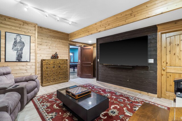 5575 S Castlebay Dr, Springfield, MO 65809 - living room featuring wood walls, track lighting, and light tile patterned floors