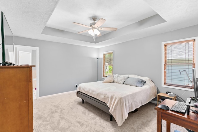 3645 S Ridgecrest Ave, Springfield, MO 65807 - bedroom featuring a tray ceiling, light carpet, baseboards, and ceiling fan