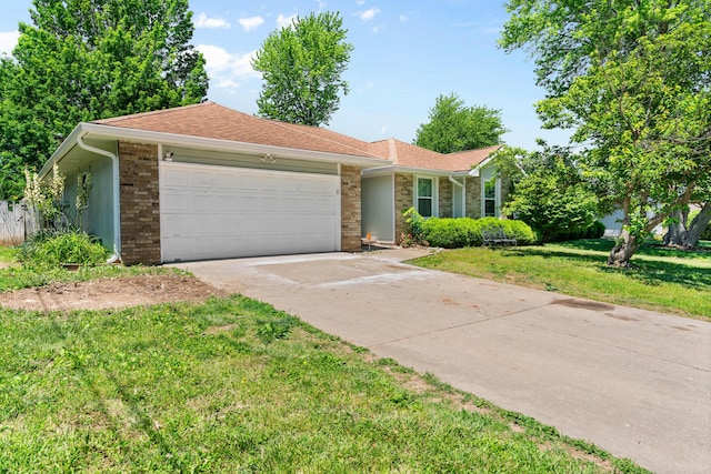 3645 S Ridgecrest Ave, Springfield, MO 65807 - ranch-style home featuring a garage, concrete driveway, and a front yard