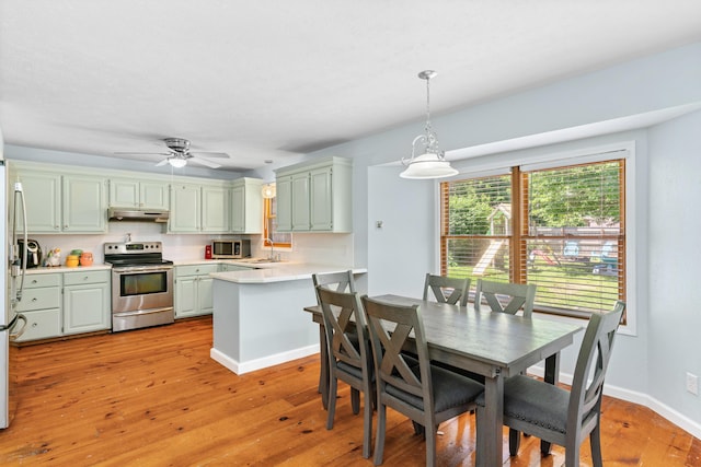 3645 S Ridgecrest Ave, Springfield, MO 65807 - dining area featuring light wood-style floors, a ceiling fan, and baseboards