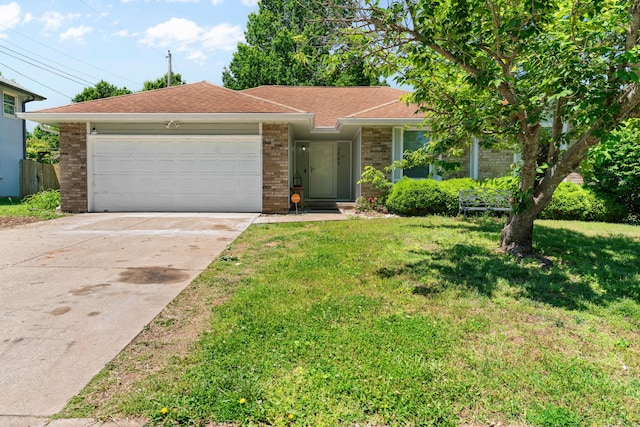 3645 S Ridgecrest Ave, Springfield, MO 65807 - ranch-style home with brick siding, a garage, concrete driveway, and a front lawn