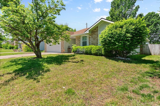 3645 S Ridgecrest Ave, Springfield, MO 65807 - view of front of property featuring driveway, brick siding, and a garage