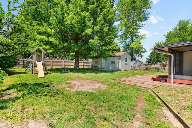 3645 S Ridgecrest Ave, Springfield, MO 65807 - view of yard featuring a playground, an outdoor structure, and a sunroom