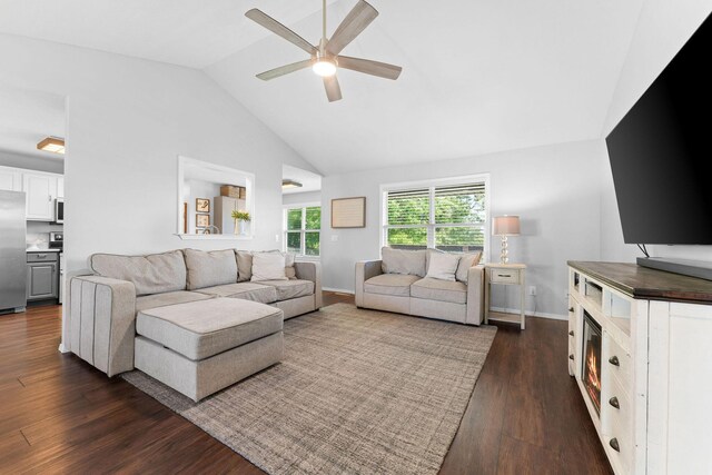 181 Rosewood Ln, Branson, MO 65616 - living area featuring ceiling fan, dark wood-style floors, high vaulted ceiling, and baseboards