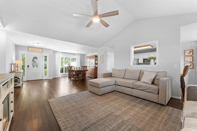 181 Rosewood Ln, Branson, MO 65616 - living room featuring ceiling fan, dark wood-type flooring, baseboards, and high vaulted ceiling