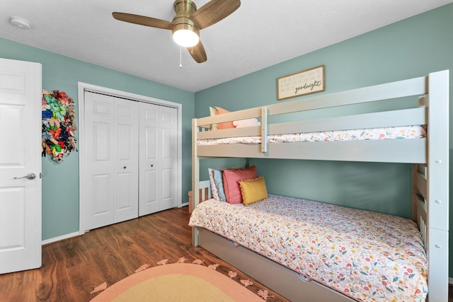 181 Rosewood Ln, Branson, MO 65616 - bedroom featuring wood finished floors, a closet, baseboards, and a ceiling fan