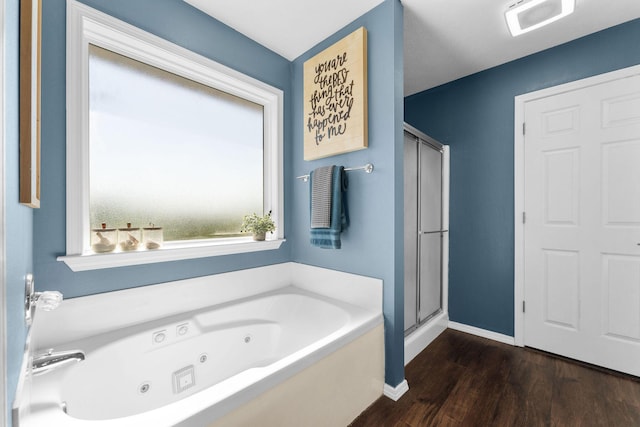 181 Rosewood Ln, Branson, MO 65616 - bathroom featuring a jetted tub, wood finished floors, a shower stall, and baseboards