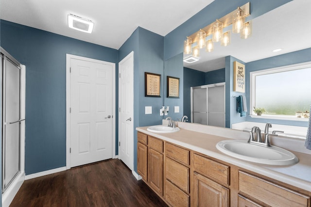 181 Rosewood Ln, Branson, MO 65616 - full bath featuring a shower stall, wood finished floors, double vanity, and baseboards