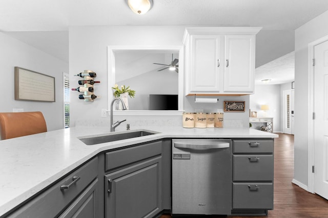 181 Rosewood Ln, Branson, MO 65616 - kitchen featuring stainless steel dishwasher, gray cabinets, a sink, white cabinetry, and dark wood-style flooring