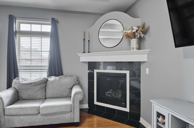 3192 W Melbourne St, Springfield, MO 65810 - living room with a fireplace, baseboards, and wood finished floors