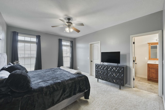 3192 W Melbourne St, Springfield, MO 65810 - bedroom with carpet floors, baseboards, ensuite bathroom, and ceiling fan