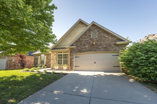 3192 W Melbourne St, Springfield, MO 65810 - view of front of home featuring an attached garage, driveway, a front lawn, and brick siding