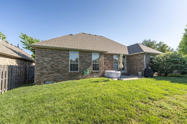 3192 W Melbourne St, Springfield, MO 65810 - rear view of house with a patio area, brick siding, a shingled roof, and crawl space