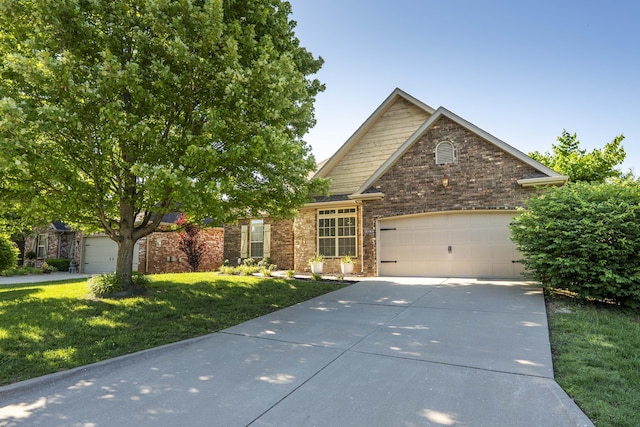 3192 W Melbourne St, Springfield, MO 65810 - view of front of home with an attached garage, concrete driveway, a front lawn, and brick siding