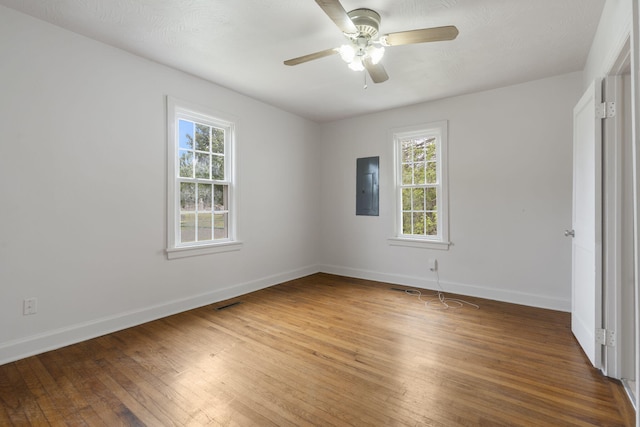 2500 W Mount Vernon St, Springfield, MO 65802 - spare room featuring electric panel, baseboards, ceiling fan, and light wood-style floors