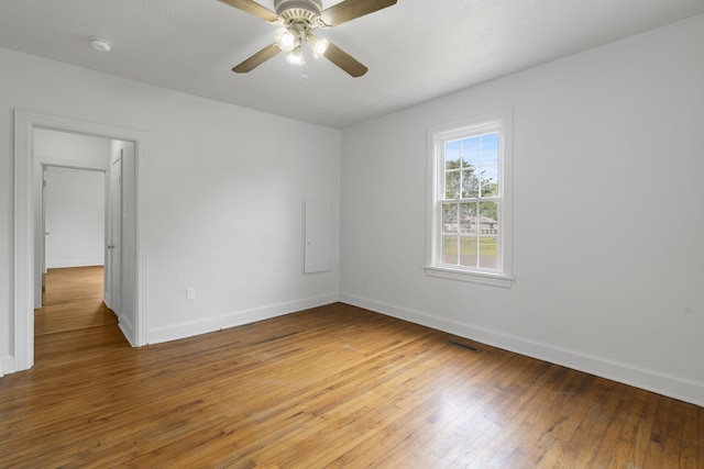 2500 W Mount Vernon St, Springfield, MO 65802 - spare room with baseboards, light wood-type flooring, and ceiling fan