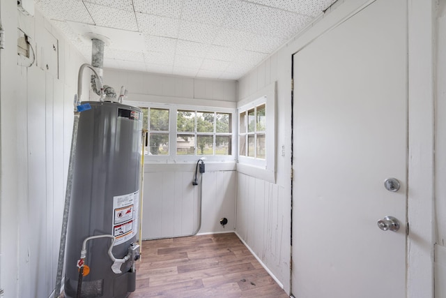 2500 W Mount Vernon St, Springfield, MO 65802 - washroom featuring water heater and light wood finished floors