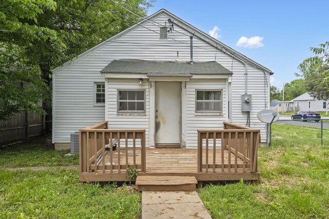 2500 W Mount Vernon St, Springfield, MO 65802 - rear view of house with a wooden deck, central AC, and a shingled roof