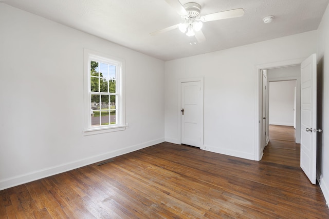 2500 W Mount Vernon St, Springfield, MO 65802 - unfurnished bedroom with baseboards, wood finished floors, and ceiling fan