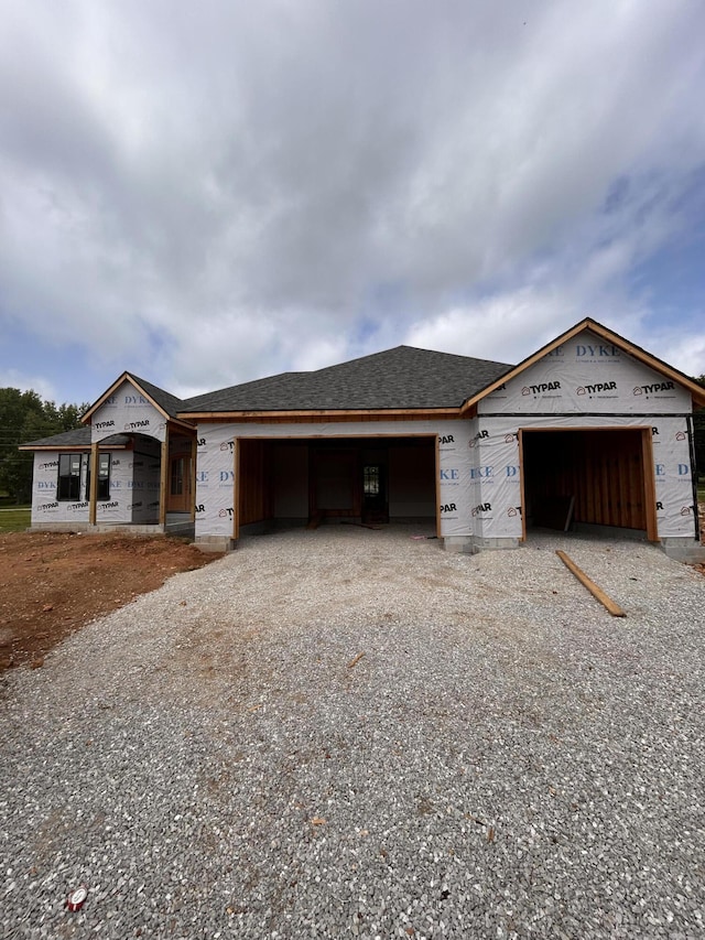 LOT20 N Silver Charm Ave, Springfield, MO 65802 - unfinished property featuring an attached garage, gravel driveway, and a shingled roof