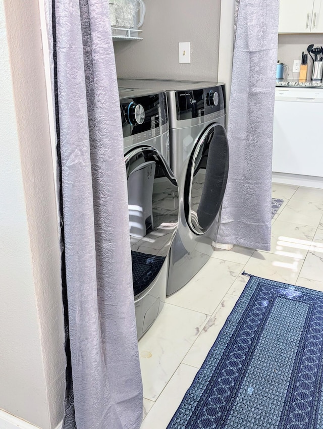 204 E College St, Walnut Grove, MO 65770 - laundry room featuring marble look tiles and washing machine and dryer