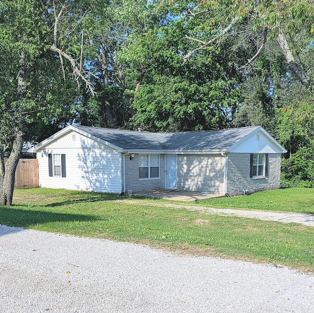 204 E College St, Walnut Grove, MO 65770 - ranch-style house with brick siding and view of wooded area