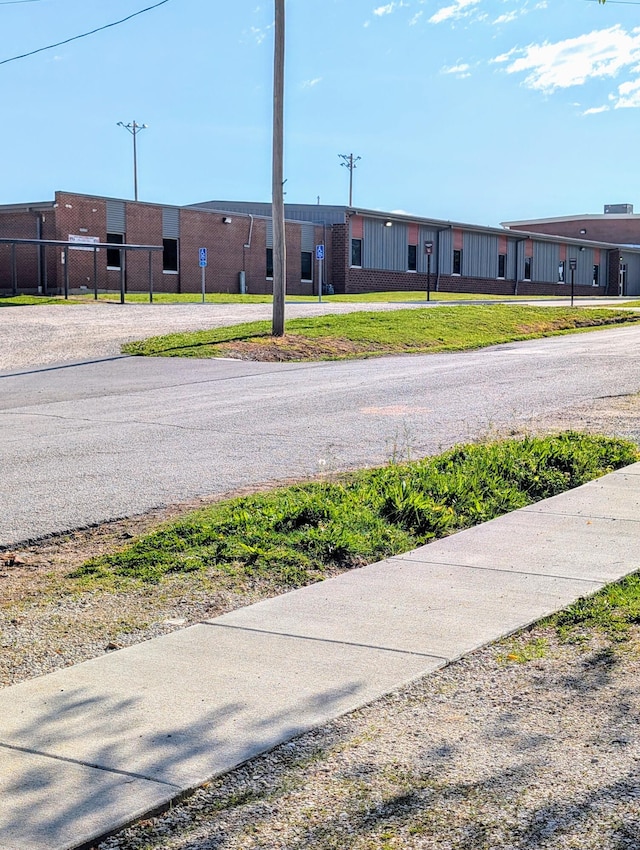 204 E College St, Walnut Grove, MO 65770 - view of asphalt road with sidewalks