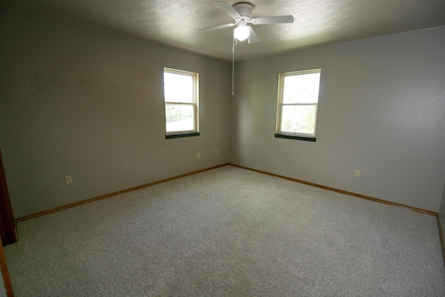 360 Banning St, Marshfield, MO 65706 - unfurnished room with ceiling fan, light colored carpet, baseboards, and a textured ceiling