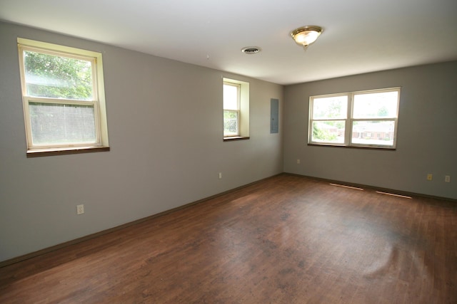 360 Banning St, Marshfield, MO 65706 - empty room with electric panel, wood finished floors, and baseboards