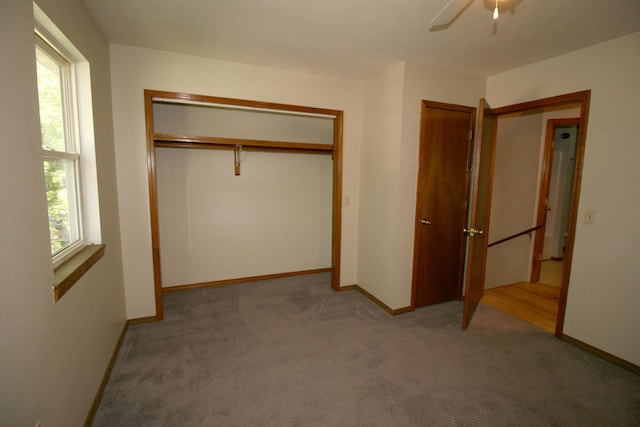 360 Banning St, Marshfield, MO 65706 - unfurnished bedroom with carpet, baseboards, a ceiling fan, and a closet