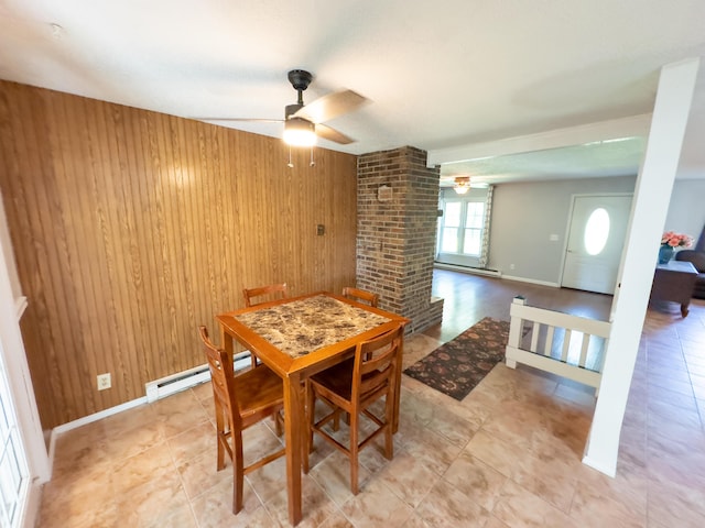 4095 Bell Springs Rd, Marshfield, MO 65706 - dining area with a ceiling fan, wooden walls, a baseboard heating unit, and baseboards
