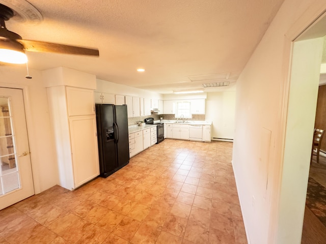 4095 Bell Springs Rd, Marshfield, MO 65706 - kitchen featuring black appliances, a sink, white cabinetry, light countertops, and a baseboard radiator