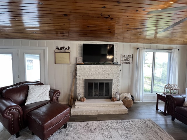 21937 Lake Rd Unit M12, Cassville, MO 65625 - living area featuring wood ceiling, a glass covered fireplace, and hardwood / wood-style floors