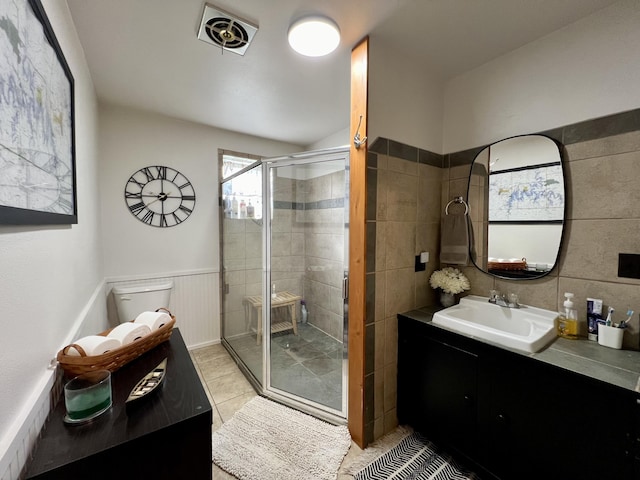21937 Lake Rd Unit M12, Cassville, MO 65625 - full bath with vanity, a shower stall, tile patterned floors, and wainscoting
