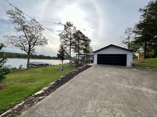 21937 Lake Rd Unit M12, Cassville, MO 65625 - view of property exterior with a lawn, a water view, a garage, and driveway