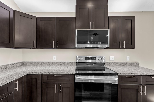 1186 Emory Creek Blvd, Branson, MO 65616 - kitchen with stainless steel appliances and dark brown cabinetry