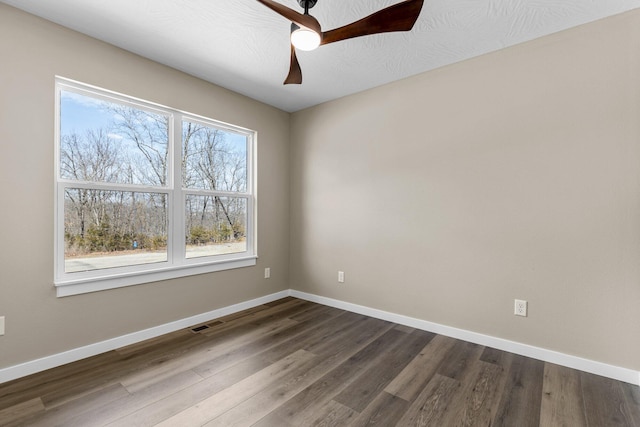 1186 Emory Creek Blvd, Branson, MO 65616 - empty room with baseboards, dark wood-style floors, and ceiling fan