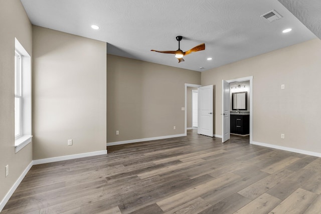 1186 Emory Creek Blvd, Branson, MO 65616 - empty room with ceiling fan, wood finished floors, baseboards, and recessed lighting