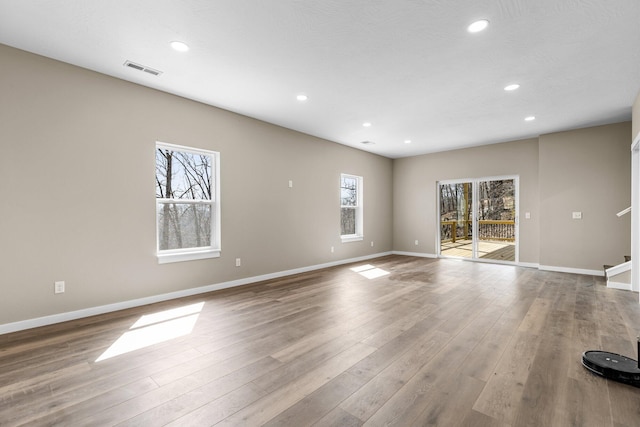 1186 Emory Creek Blvd, Branson, MO 65616 - unfurnished living room with healthy amount of natural light, recessed lighting, baseboards, and wood finished floors